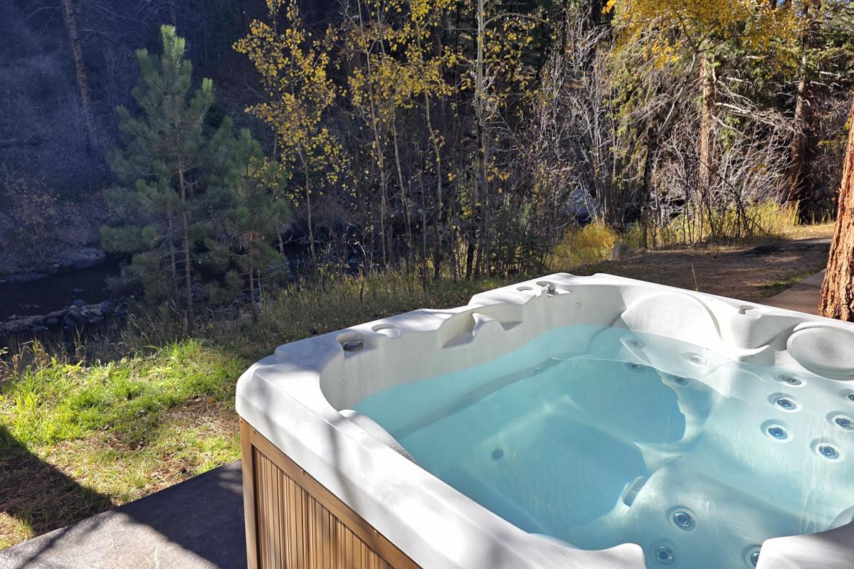 Personal hot tub on fall river in Estes Park