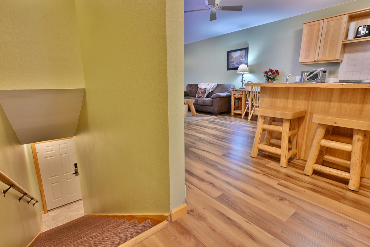 Staircase leading to the king bedroom in a Riverview Suite condo